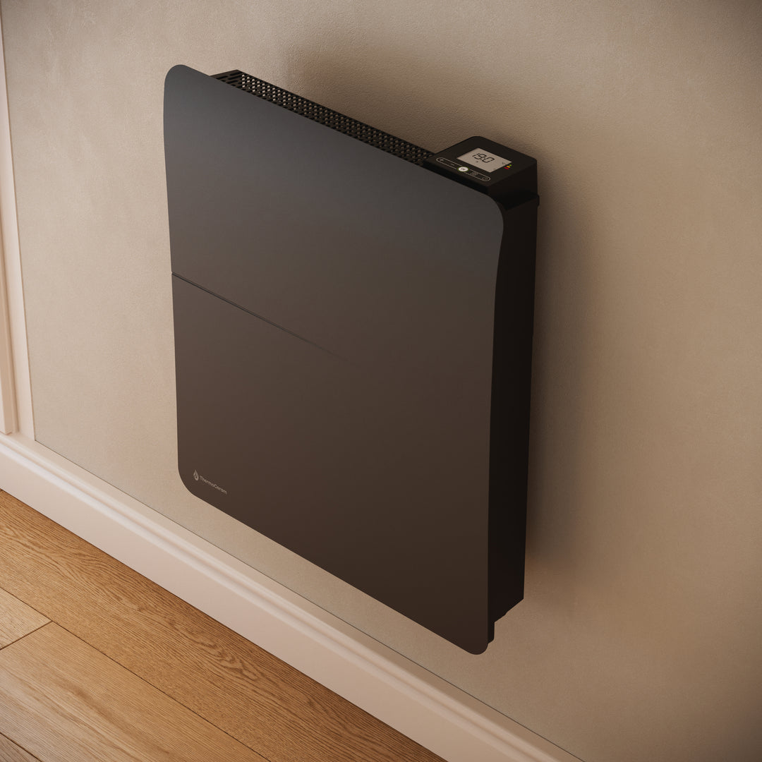 Radiateur Cira 1000 W noir — gros plan de trois quarts sur le thermostat